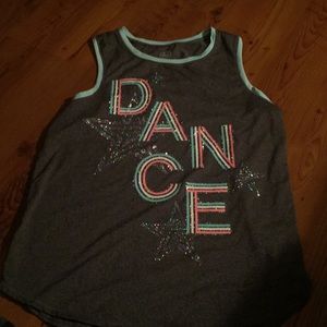 A tank top that says “Dance”.